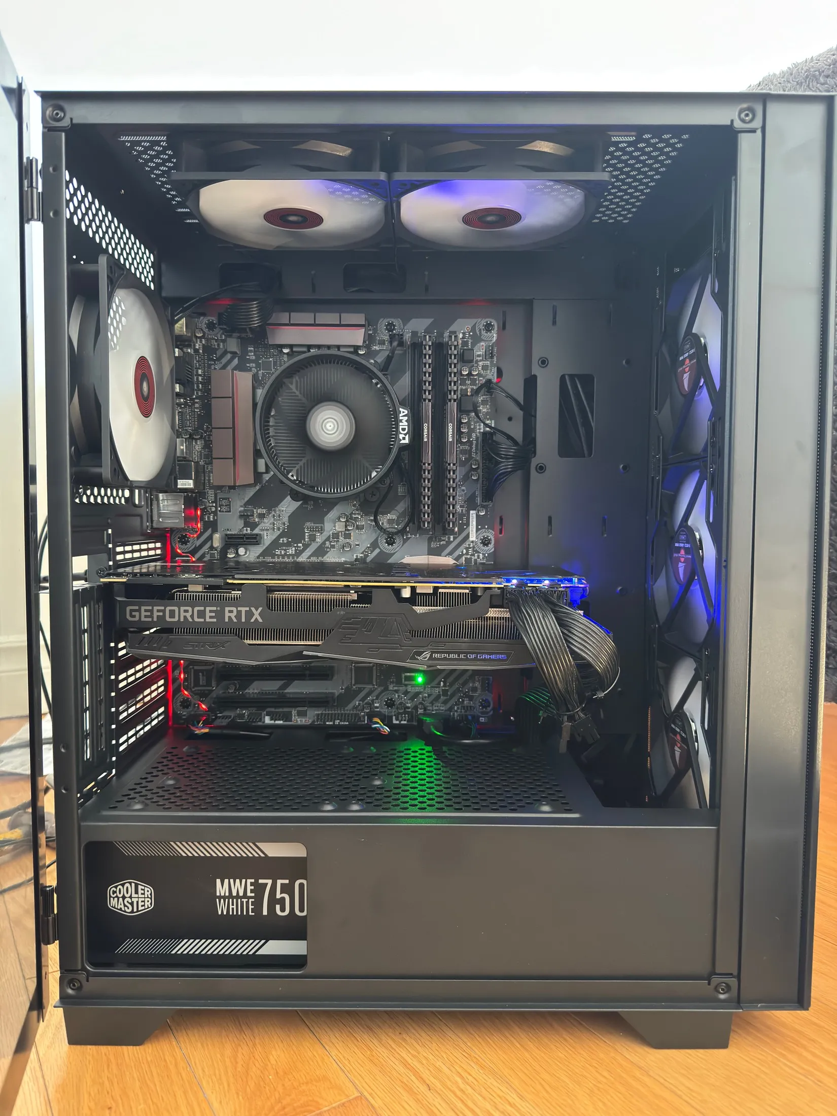 Budget gaming build — AMD platform with an ROG Strix RTX card and RGB airflow fans